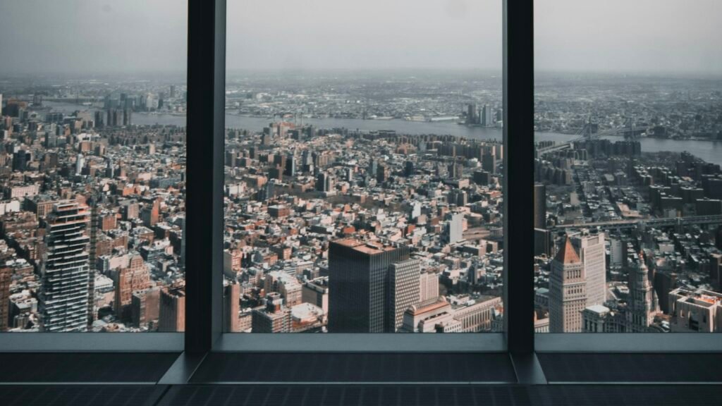 A wide city view from an office window while weighing the signs you should quit your job