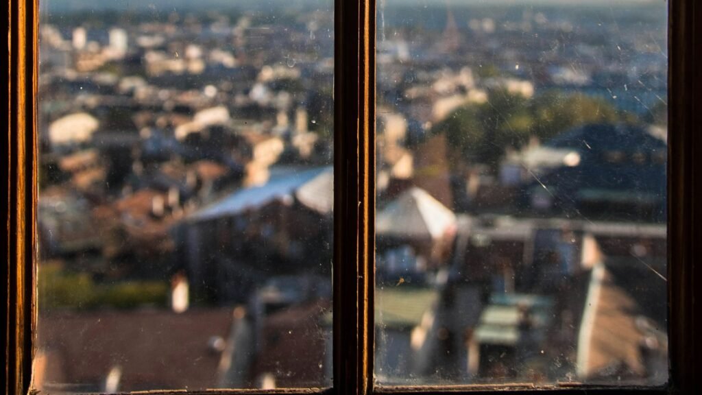 A city view through an apartment window, the outlook for a professional starting a business at 50