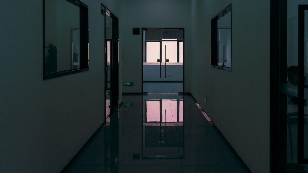 Empty office corridor at night, illustrating toxic work environment signs